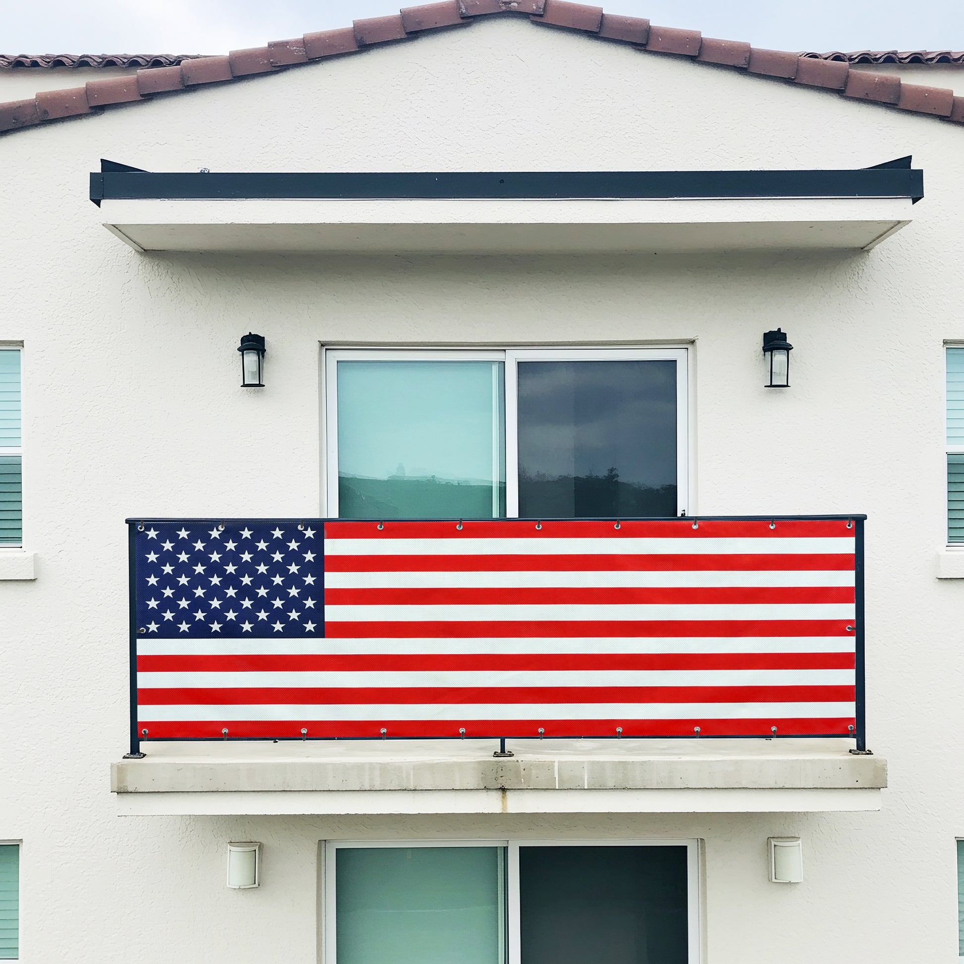 DIY American flag banner on a balcony of a house