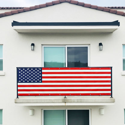 DIY American flag banner on a balcony of a house